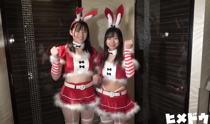 Two Japanese girls complete looks in christmas costumes